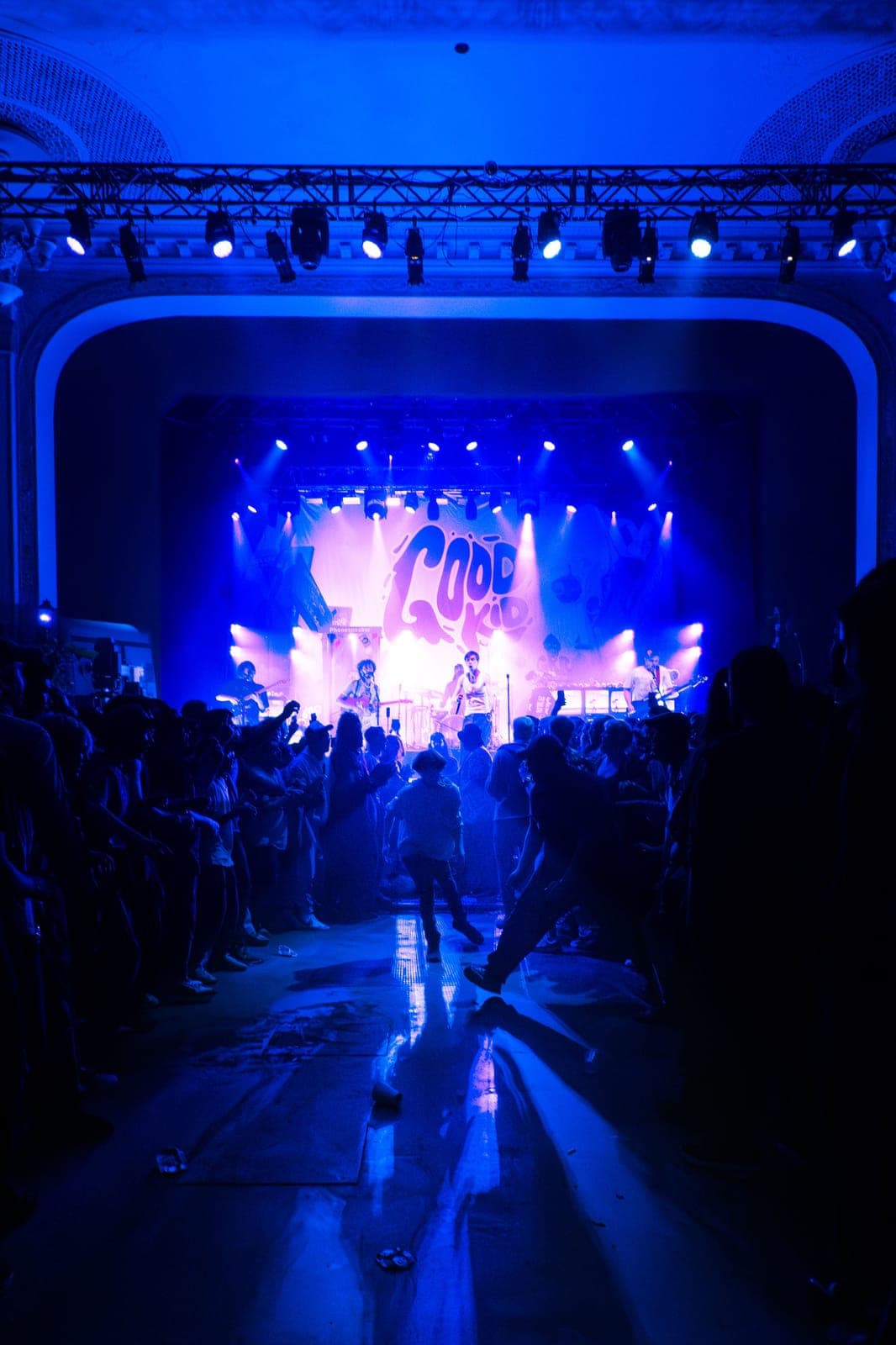 The Danforth Music Hall crowd splits down the middle for Good Kid's wall of friendship under blue light in Toronto
