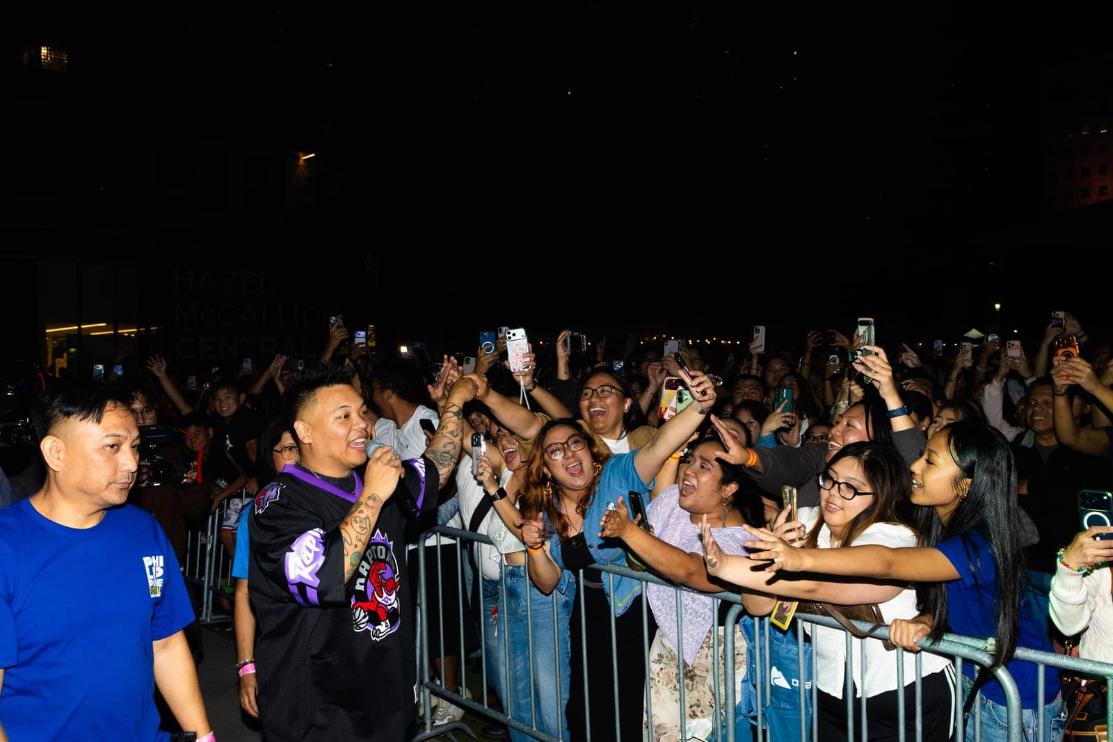 AJ Rafael sings to fans stretching over the barricade outside the Hazel McCallion Central Library at Philippine Festival Mississauga