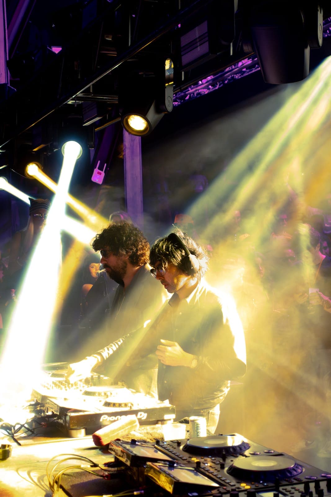 Justice bathed in golden beams of light while DJing at Factory Town, Miami