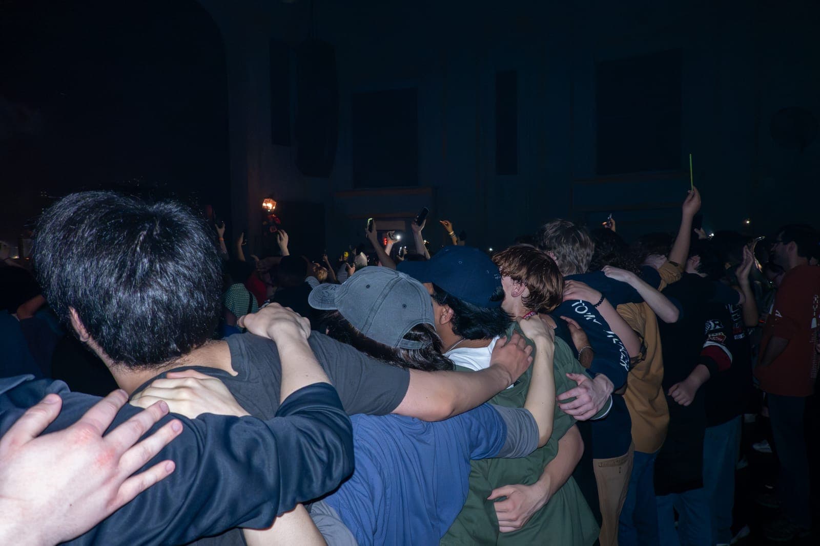 Fans throw their arms around each other's shoulders during Good Kid's set at Danforth Music Hall in Toronto