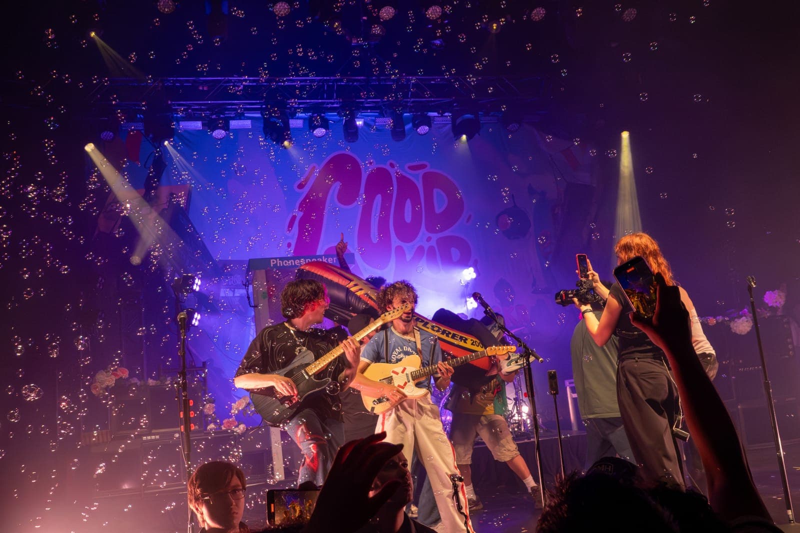 Good Kid's guitarists trade riffs amid a flurry of bubbles under the GOOD KID backdrop at Danforth Music Hall, Toronto