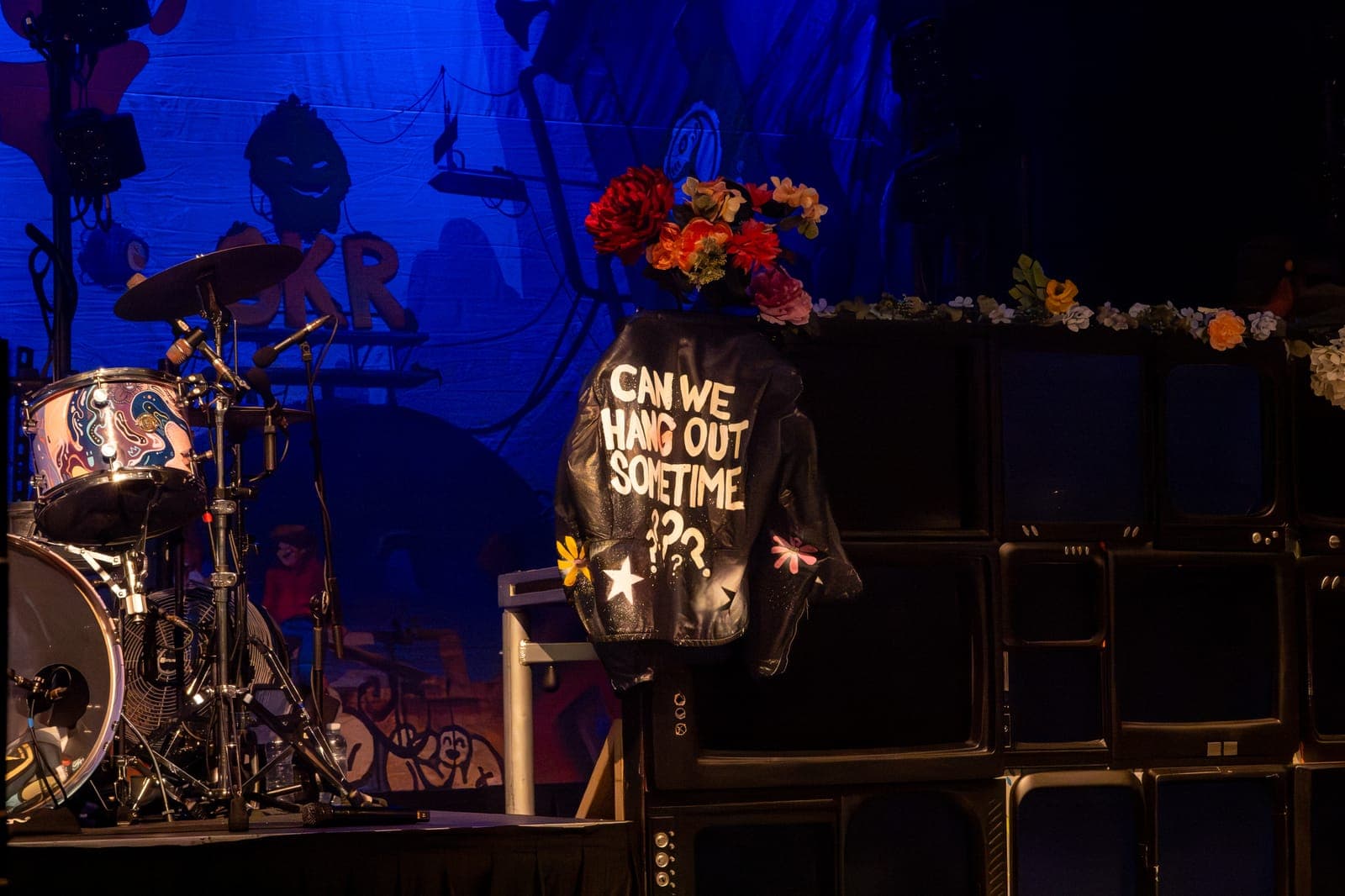 A hand-painted 'Can We Hang Out Sometime???' jacket and flowers decorate Good Kid's stage at Danforth Music Hall, Toronto