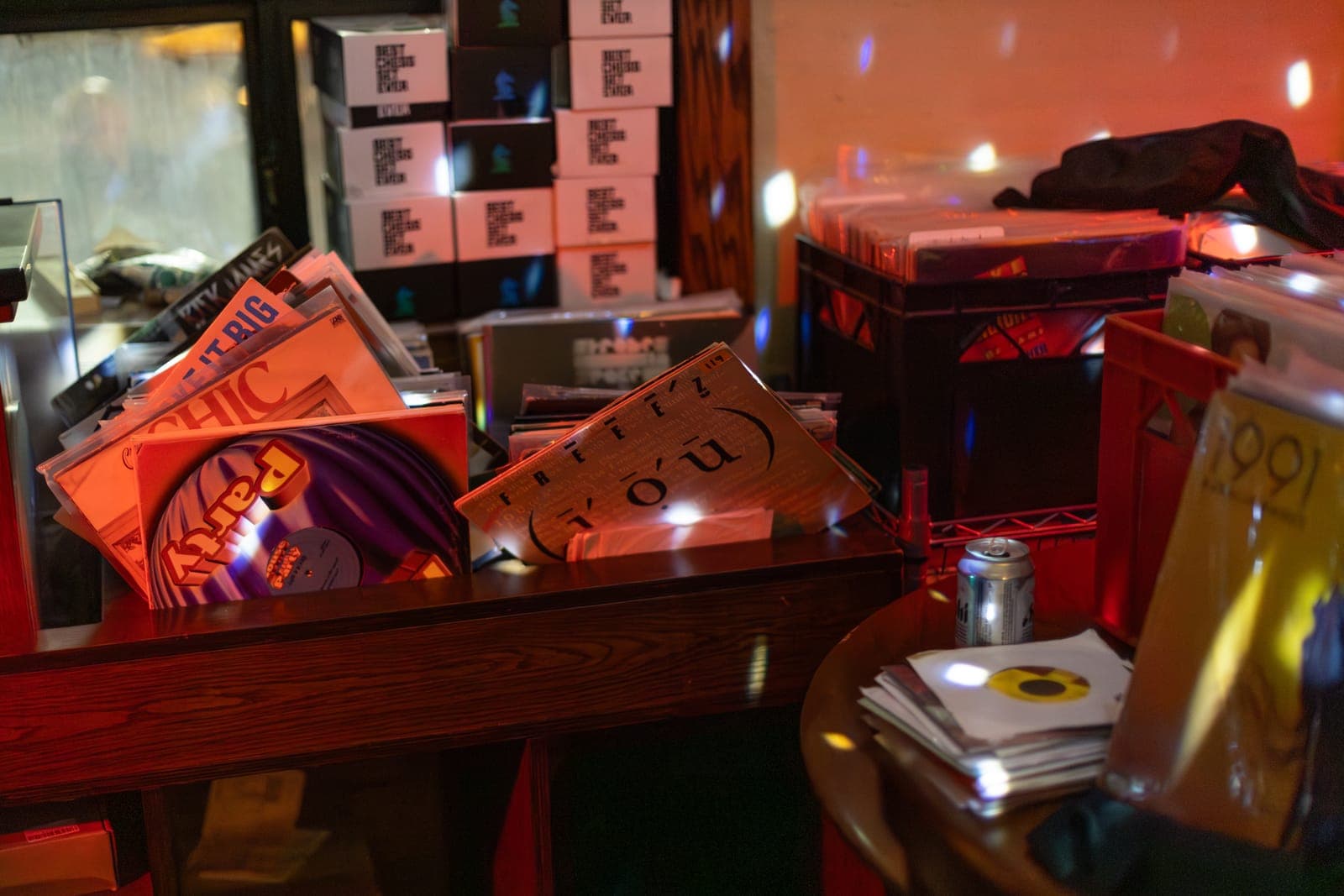 Crates of vinyl records line the counter at the Make Me Feel Club night at 915 Dupont in Toronto