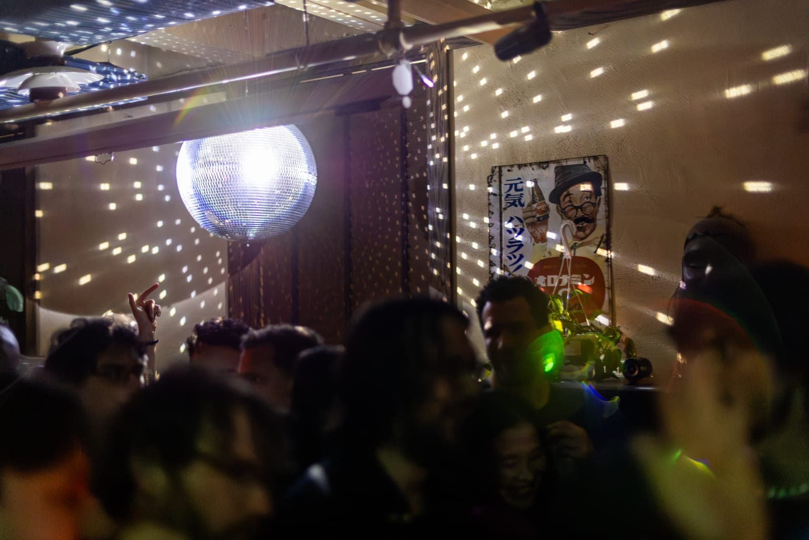 A disco ball scatters light across the dancefloor at the Make Me Feel Club night at 915 Dupont, Toronto