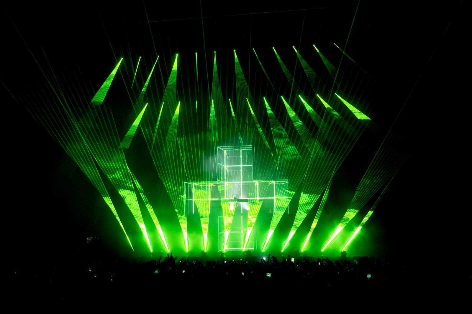 A fan of green lasers floods the arena over Martin Garrix's stage at RBC Amphitheatre in Toronto