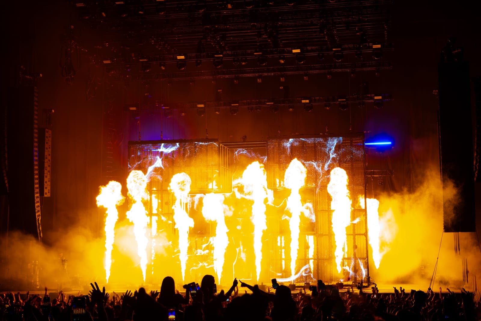 A row of flame jets erupts across Martin Garrix's stage at RBC Amphitheatre in Toronto