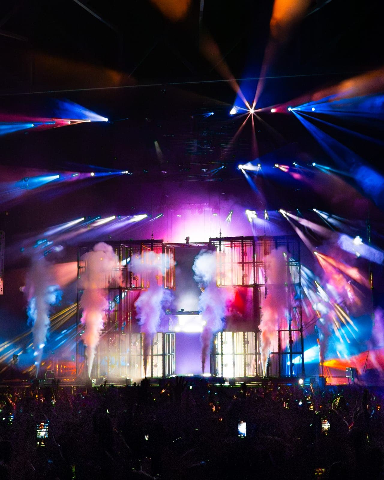 Purple and blue beams and CO2 jets surround Martin Garrix's cube stage at RBC Amphitheatre, Toronto