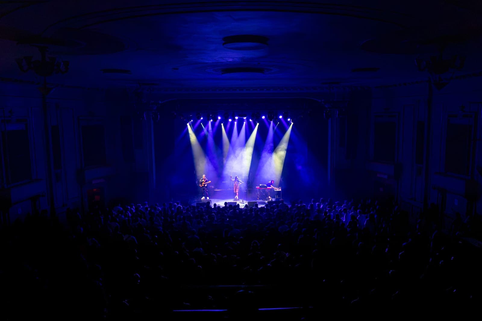 The ornate Danforth Music Hall glows blue and purple as Maya Killtron's trio performs to a packed floor
