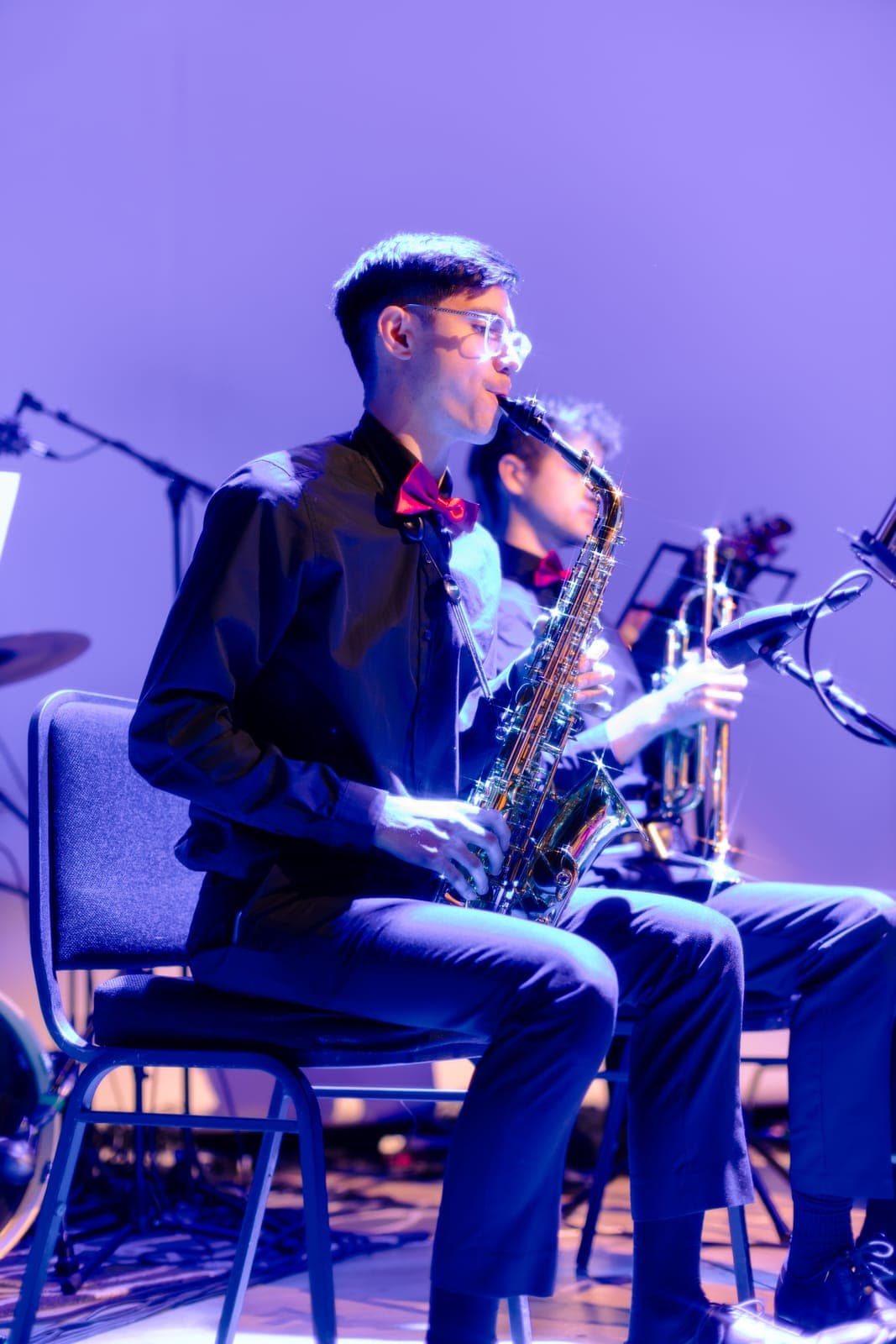 A saxophonist in a red bow tie plays with the Toronto Pops Orchestra at the Keung To fan event at TD Music Hall, Toronto